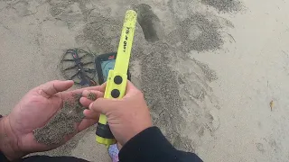 Beach metal detecting in the rain