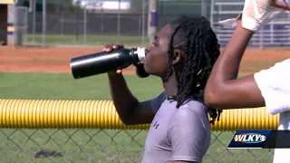 Male High School keeping football players safe in the summer heat
