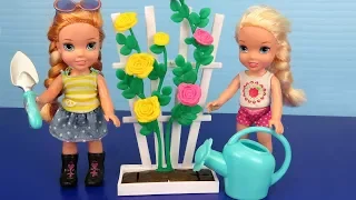 Elsa and Anna toddlers plant vegetable seeds and flowers