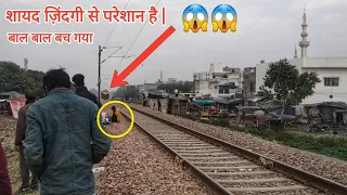 This Crazy Man Narrowly Escaped Being Hit by a Speeding Train 😱😱