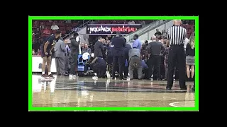 Sc state's ty solomon 'stable and conscious' after collapsing at pnc arena :
