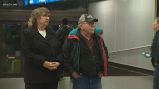 Travelers arrive at Sea-Tac Airport after being rocked by Alaska earthquake