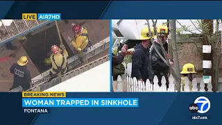 Woman rescued after falling into 25-foot sinkhole in California