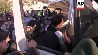 Police remove Palestinian protesters who returned to scene of eviction