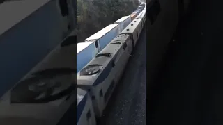 Super Fast Amtrak Speeds Past CSX Train At 80 MPH Overhead View