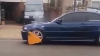 BMW with parking boot refuses to stop for anyone