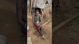 Mursi tribe mother giving traditional bath for her child omo valley Ethiopia #viralshorts #viral