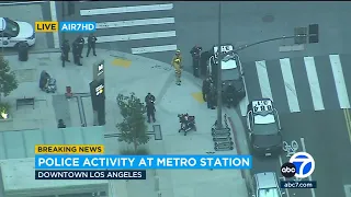 2 in custody after suspect gets on top of train at DTLA Metro station