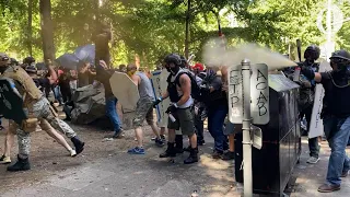 Opposing rallies battle with mace, paint balls and rocks near Justice Center in downtown Portland