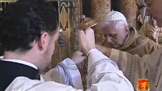 Msgr. Piero Marini shows how to hold the censer