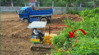 new project showing Bulldozer D-20-P Pushing Clearing Sand By Dump Trucks Unloading