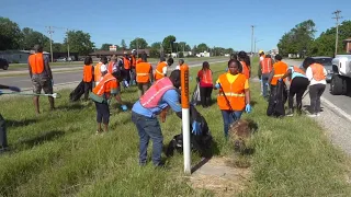 Quad City Togolese immigrant group hosts clean up along Avenue of the Cities