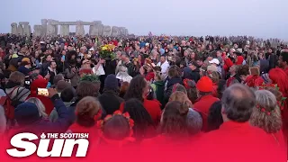 Crowds gather at Stonehenge to watch the summer solstice sunrise