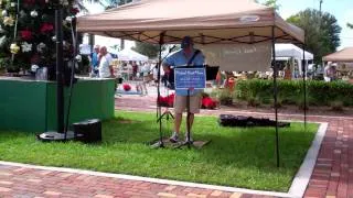 Michael Hirst performing at the Down Town Punta Gorda Farmers Market