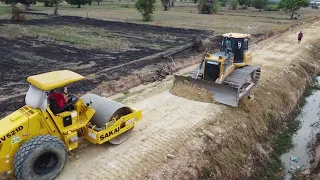 Construction of roads next to canals with modern and large machinery