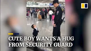 Cute boy wants a hug from security guard