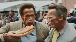 Arnold Schwarzenegger eating Hot Dogs