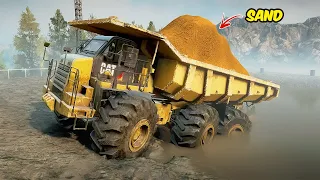 CAT TRUCK TRANSPORTING SAND IN SNOWRUNNER