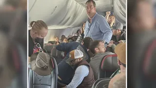 American Airlines passenger tackled after trying to open plane door mid-flight