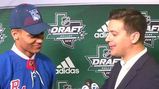 Rangers top pick K'Andre Miller talks with Brad Galli at the NHL Draft