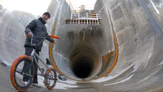 RIDING BMX INSIDE OF A MASSIVE FULL PIPE 50FT UNDERGROUND!