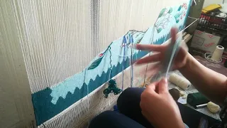 Weaving on a vertical loom - the border of an Oltenia style kilim