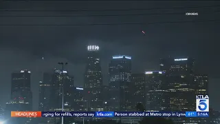 SpaceX rocket with spy satellites seen over downtown L.A.