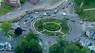 Hundreds take part in silent vigil at West Roxbury rotary in honor of George Floyd