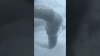 Kansas man captures rare angle of funnel cloud spiraling into sky