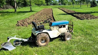 plowing the garden with 1970 John deere 112h patio and brinly plow