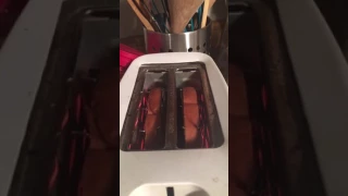 Toast popping out of a toaster