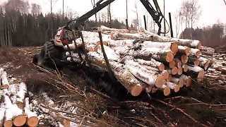 Valtra forestry tractor stuck in wet forest, difficult conditions