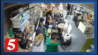 Video shows gas station robbery, with suspects pinning workers to the ground