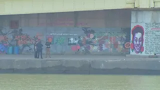 BLM mural along river walk vandalized with paintballs