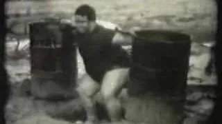 paul anderson squats two 55 gallon concrete barrels