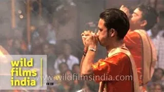 Priests blow conch shell 'Shankh' before Ganga aarti at Banaras