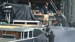 Tinie tempah makes every get down on the floor supporting the script in the aviva july 2011