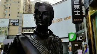 A little girl and Michael Jackson statue in Zhengzhou, China