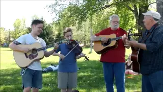 Billy Strings and his father with friends