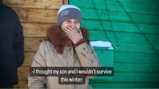 A Russian woman began to cry when she saw a truckload of firewood as a gift.