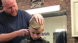 Barber pranks this kid by pretending he has cut his ear Off