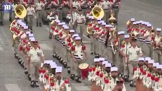 Macron and Merkel watch as military parade marks Bastille Day