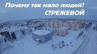 Drone flies over the city Strezhevoy. Winter.