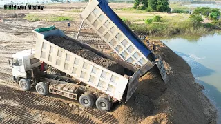 Nice Showing Action Bulldozer Working, Dozer push sand into the water, Long Dump Truck Unloading