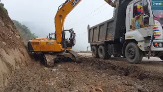 Busy Hilly Road-Clearing Trench Dirt after Hilly Landslide-JCB Excavator