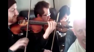 Jigs On A Plane!  Newfoundland fiddlers play the music of Emile Benoit - on an airplane!