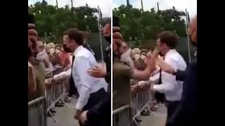 French President Emmanuel Macron slapped while greeting crowd, 2 detained