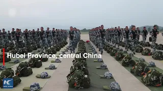 Chinese paratroopers showcase air-to-water prowess