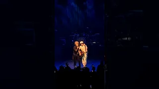 Green Day, Billie Joe Armstrong invites a fan to play Good Riddance on guitar on stage at Bataclan
