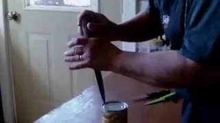 Opening a can with a knife